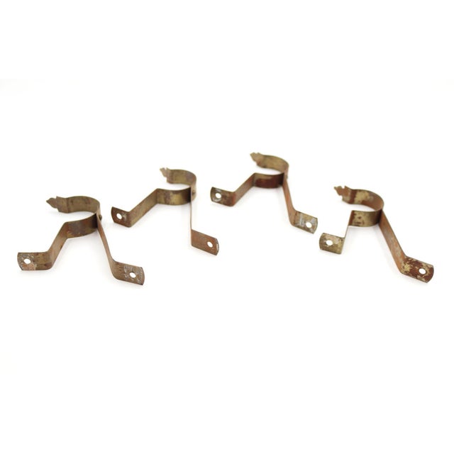 Vintage curtain rod brackets made of brass plated steel. The original mounting screws are not available. Good condition...