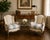 Timeless and inviting, this pair of Louis XV–style wingback bergère chairs features beautifully carved giltwood frames and...