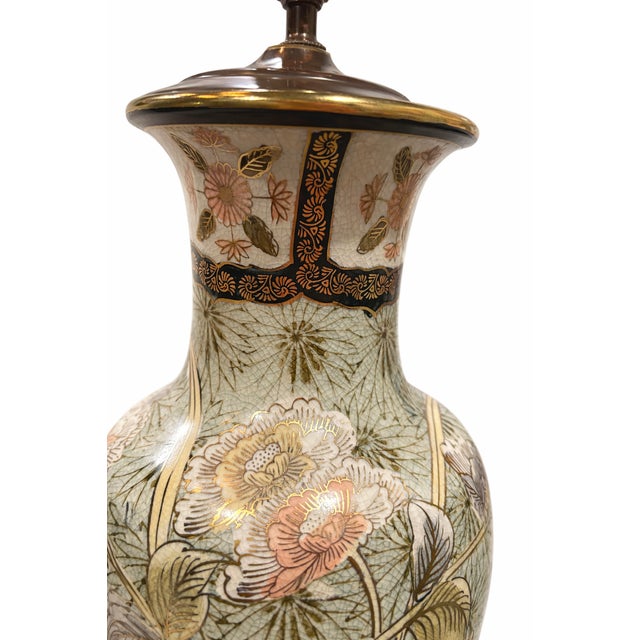 A refined 1970s Chinoiserie porcelain table lamp featuring a softly celadon-toned ground adorned with delicate hand-...