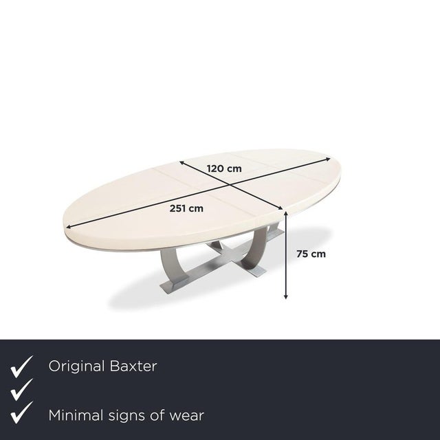 with the Baxter Gilbert, you get a dining table that redefines luxury, blurring the lines between furniture design and...