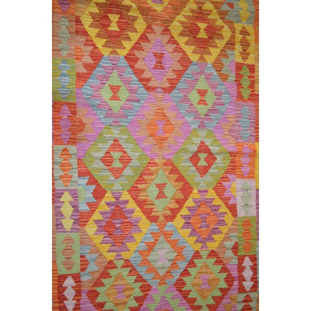 Vintage Afghan Maimana hand woven kilim with natural colors and geometric pattern.
