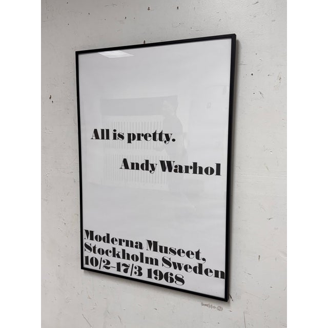 Design Plus Gallery presents an “All is Pretty” exhibition poster by Andy Warhol, framed art print. This graphic piece...