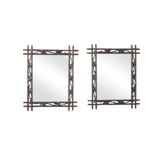 A Black Forest wall mirror from the early 20th century, with carved vine motifs. We currently have three mirrors...