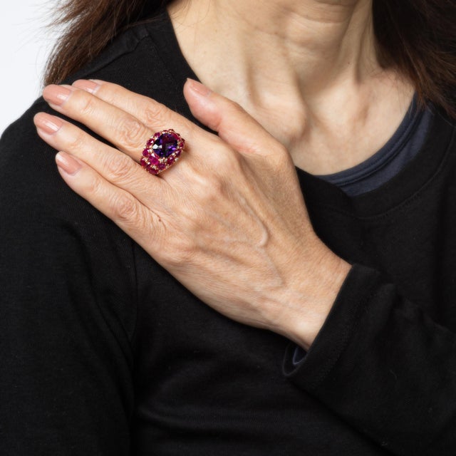 Stylish contemporary amethyst, ruby and diamond band crafted in 18 karat rose gold. Checkerboard faceted amethyst measures...