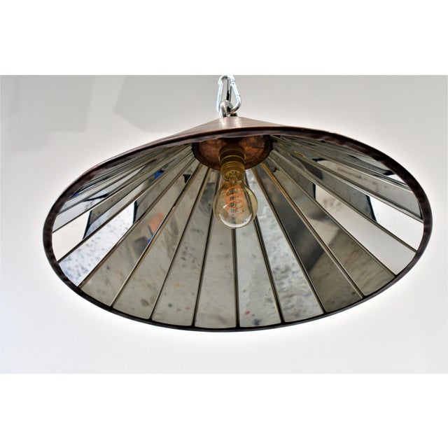 21 panels of stainless steel plates reflect one light bulb, resulting in a spotlight effect. One E27 socket. This pendant...