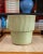 Dimensions: 10.75” H x 11.5” D Substantial ceramic planter in a soft sage green glaze with fine speckling throughout....
