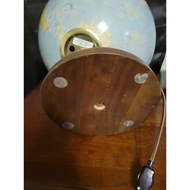 1957-1960 Replogle Comprehensive illuminated globe with brass meridian mounted on a walnut base. Original, operational...