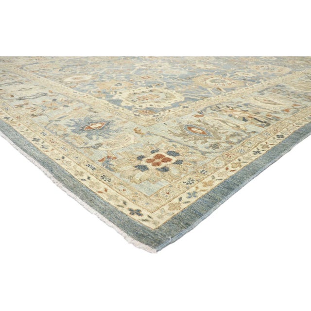 60919 Persian Sultanabad Rug, 13'00 x 15'09. This hand-knotted wool Persian Sultanabad rug features an all-over botanical...