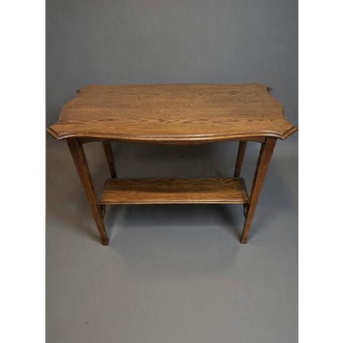 A charming early 20th century Arts and Crafts occasional table, raised on original castors. This well-proportioned piece...