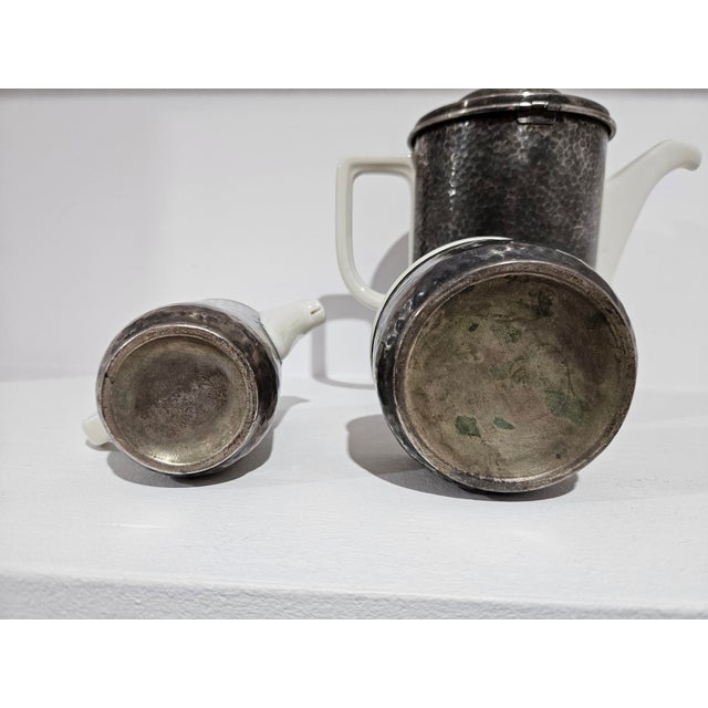 A unique, three-piece coffee or tea set, a beautiful example of Art Déco design from the 1930s. The set consists of a jug,...