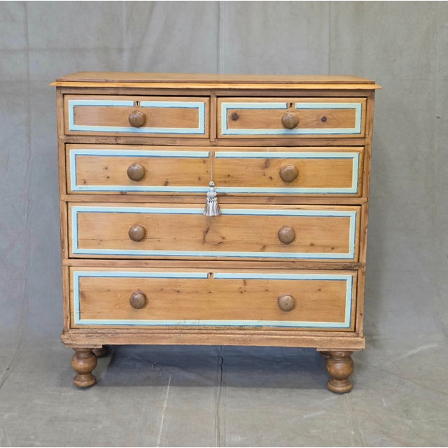 An absolutely charming antique early 1900s English Edwardian rustic natural pine chest of drawers dresser with a blue...