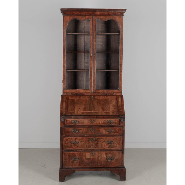 A fine 18th Century George II Period walnut bureau bookcase, in two parts. The upper section had two doors with original...