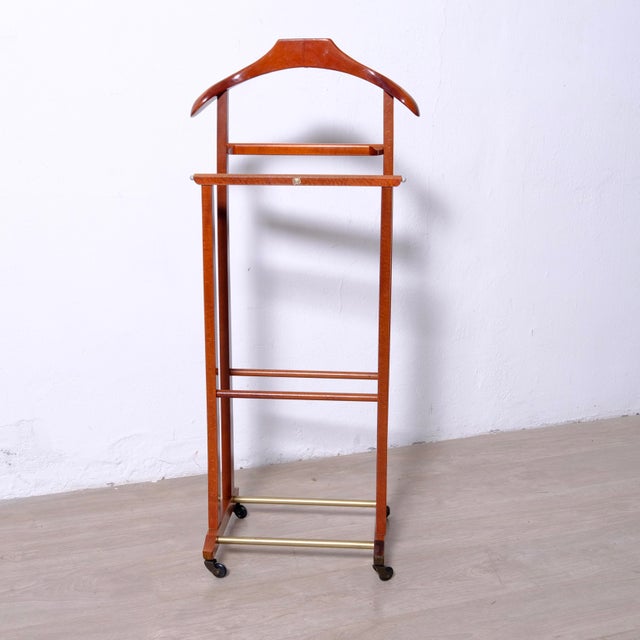Vintage wooden valet stand (1970s), F.lli Reguitti. In excellent condition. A true work of art that not only adds great...