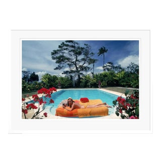 Sunbathing in Barbados 1976 by Slim Aarons White Framed C-Print For Sale