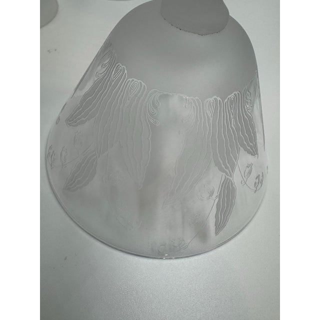 Elegant hand-blown crystal coupes, c. 1930s–1950s, featuring delicate wheel-engraved lily-of-the-valley florals and...