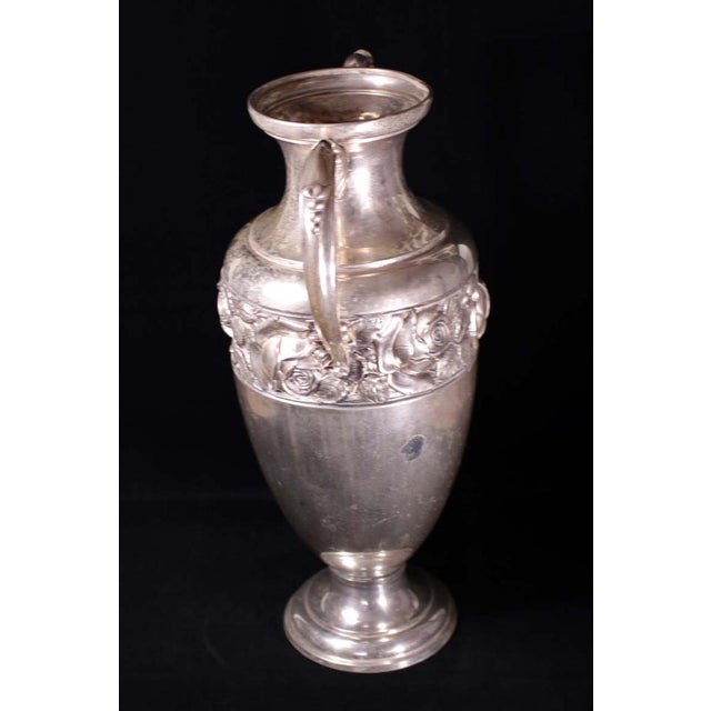A beautul silver plated brass amphora, suitable for beautiful flower bouquets, it will uplift any living room.