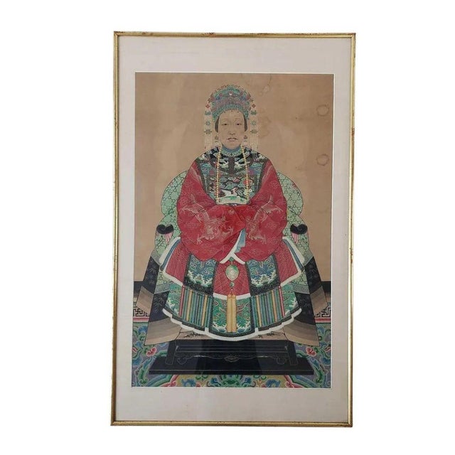 This pair of framed portraits captures the regal presence and dignified poise of historical Chinese figures, likely an...