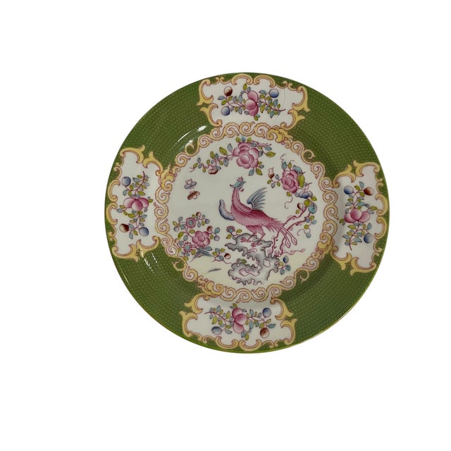 An elegant pair of vintage Minton Cockatrice porcelain plates featuring a rich olive-green ground, delicate bird motifs,...
