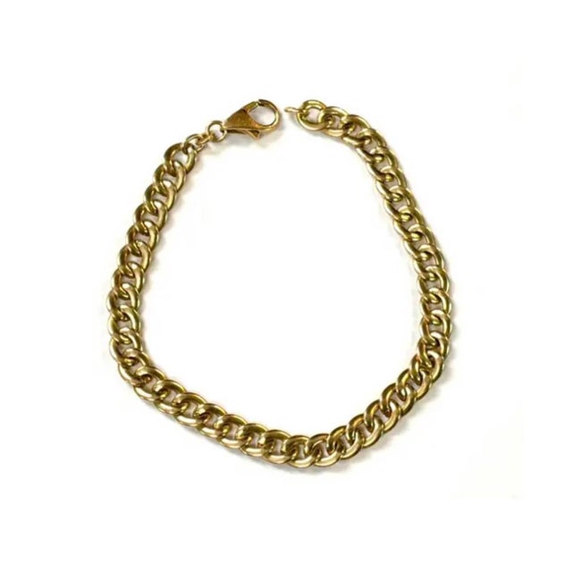 Vintage 14K Yellow Gold Italian Link Bracelet. This bracelet features polished rounded curb-style links that create a...