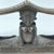A carved double headrest from the Songye people is a sculptural sleeping support traditionally used in the savanna regions...