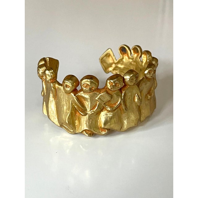 A gilt bronze bracelet by Line Vautrin (1913-1997), circa 1945-46. The design is known as "La Manif" or "La...
