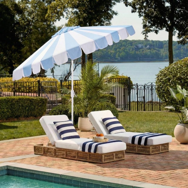 Transform your outdoor space with the Meze 9 ft crank umbrella in a charming baby blue stripe. This elegant shade solution...