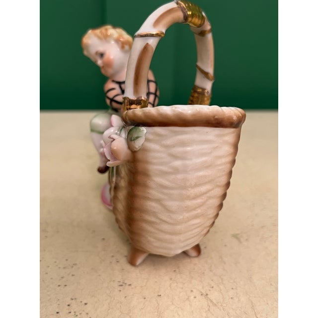 Vintage Porcelain Figurine of Boy Climbing on Basket For Sale - Image 4 of 5