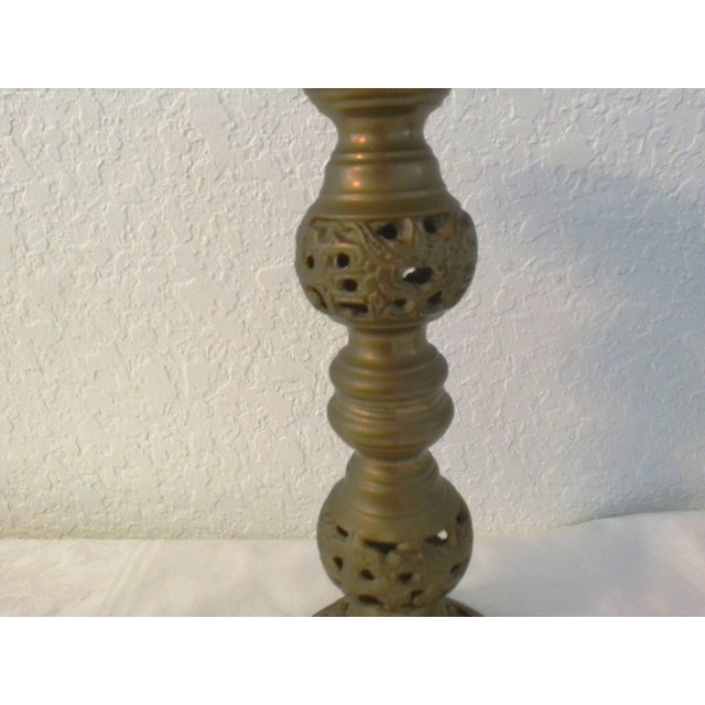 Ornate perforated generous size solid brass candle holder. Holds one pillar candle.
