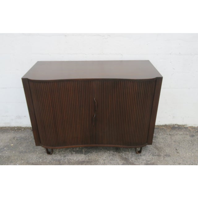 This high quality Dresser is made of wood, solid wood, mahogany, and veneer. It was made by Edward Wormley for Dunbar....