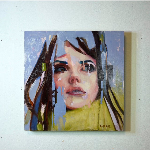 This oil on panel artwork features a close-up of a young woman's face, her expression conveying a sense of introspection...