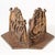 These vintage iron bookends have a gold paint overlay that shows wear and age. Stamped on the back side of the bookends...
