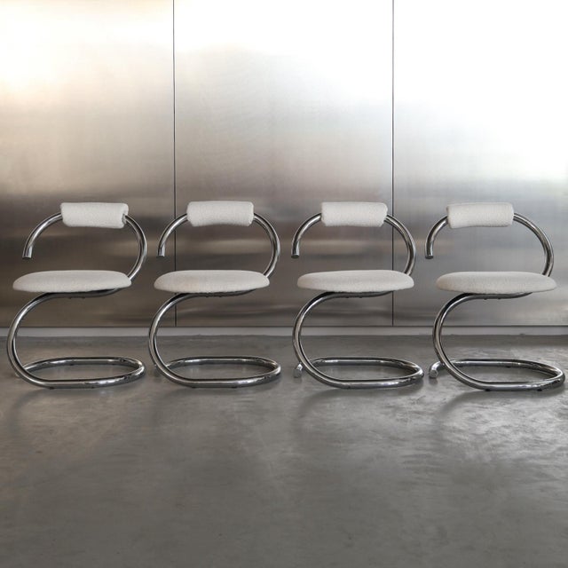 Striking set of four Cobra chairs, designed by Giotto Stoppino in the 1970s. Characterized by their distinctive curved...