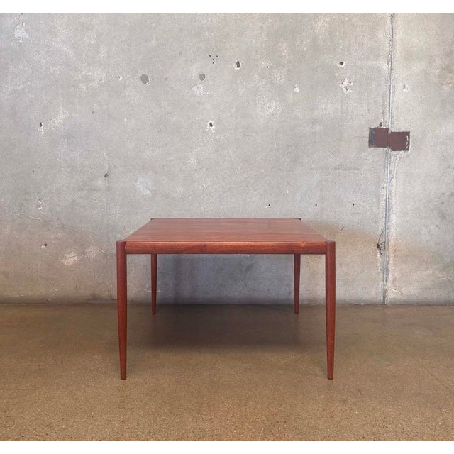 Authentic Danish Modern side table by Kristiansen & Thomassen. Crafted in beautifully figured teak with tapered solid teak...