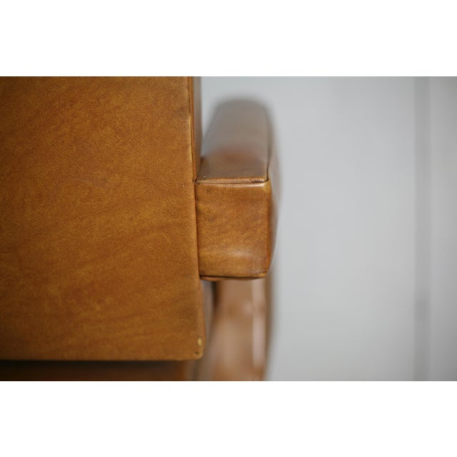 Armchair attributed to Jacques Adnet, circa 1955 Comfortable, solid and stable. Small marks (scratches and shocks, see...