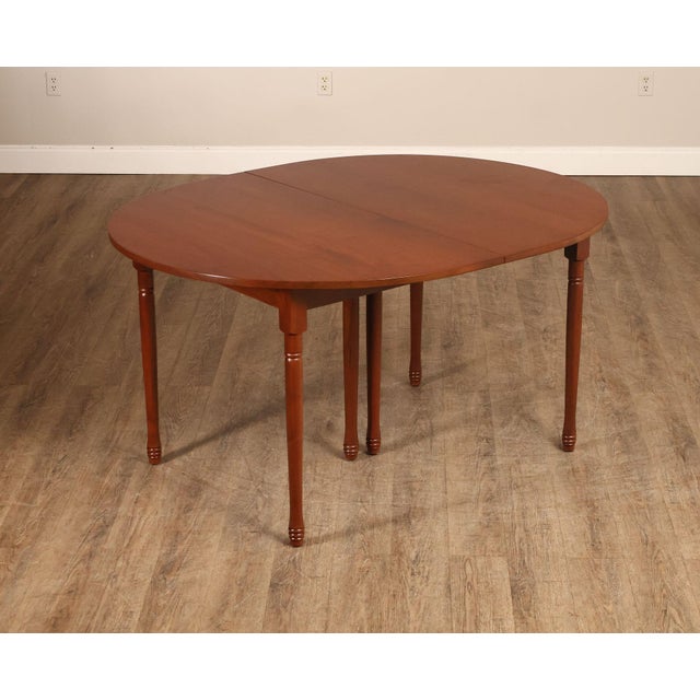 High Quality American Made E. A. Clore Custom Solid Walnut Extendable Dining Table Featuring A Rounded Oval Top, Turned...