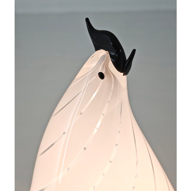 Stunning vintage rooster-shaped table lamp in white Murano glass with a spiral decoration, made in Italy in the 1970s and...