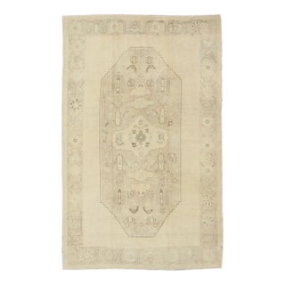 Faded Turkish Oushak Rug With Cream and Brown Central Medallion 5'6 X 8'6 For Sale