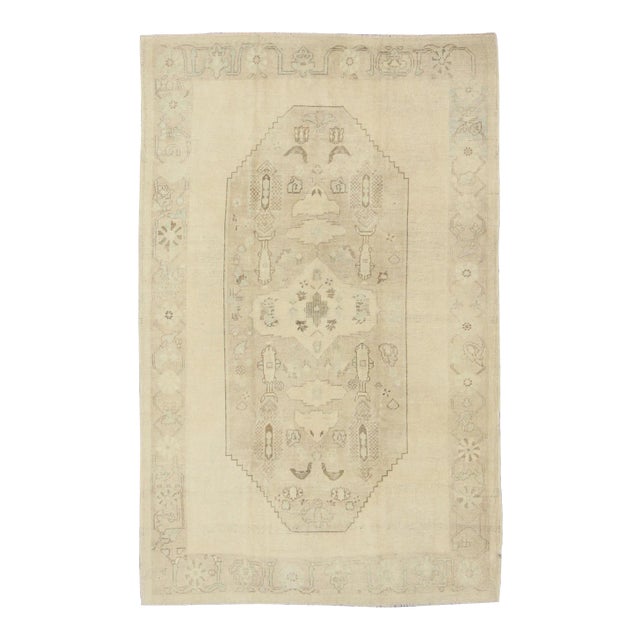 Faded Turkish Oushak Rug With Cream and Brown Central Medallion 5'6 X 8'6 For Sale