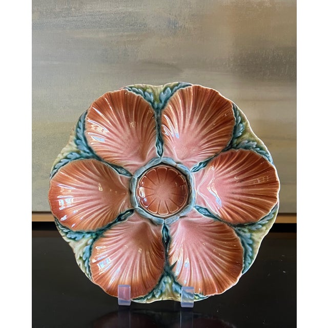 Antique oyster plate made by Sarreguemines in France around 1890. The six wells are a shell shape surrounded by a seaweed...