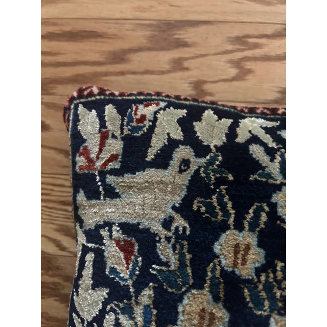 Circa 1960 rug pillow case hand knotted on a navy blue background and a creamy taupe color decorated with a vase and...