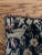 Circa 1960 rug pillow case hand knotted on a navy blue background and a creamy taupe color decorated with a vase and...