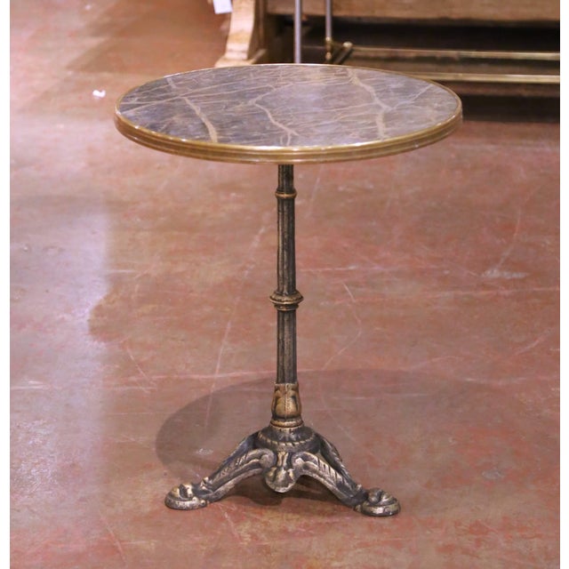 This antique French bistro table, crafted circa 1920, has the classic café scale and silhouette that make these pieces so...
