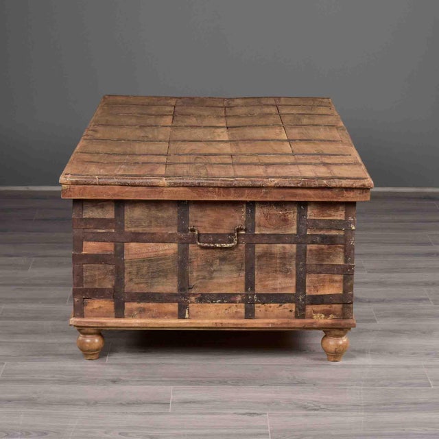 This large Anglo-Indian trunk is constructed in teak and clad throughout with a grid of hand-forged iron strapping,...