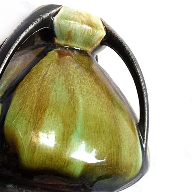 Art Nouveau ceramic four handled vase. There is some crazing, as seen in the pictures.