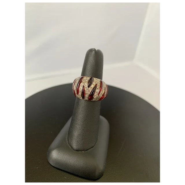 Angelique de Paris ring crafted with bold ruby resin in sterling silver with a platinum rhodium finish and hand set cubic...