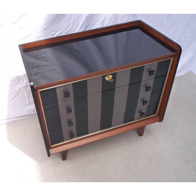 Beautiful vintage chest of drawers with 4 drawers on 4 legs (non-removable) Glossy black laminate top with raised edges...