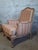 An elegant louis xv style bergère armchair, combining period charm with contemporary freshness in a particularly...