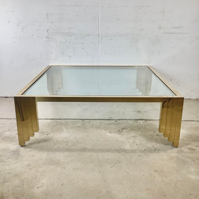 This striking square coffee table translates the visual language of American skyscraper architecture — stepped, ziggurat,...