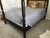 Carved mahogany four poster queen bed frame with caning to headboard. An exquisite piece! Quality hardwood construction to...