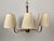 A beautiful mid-century chandelier from Josef Frank. This six arm lamp is made of brass with walnut accents. The...